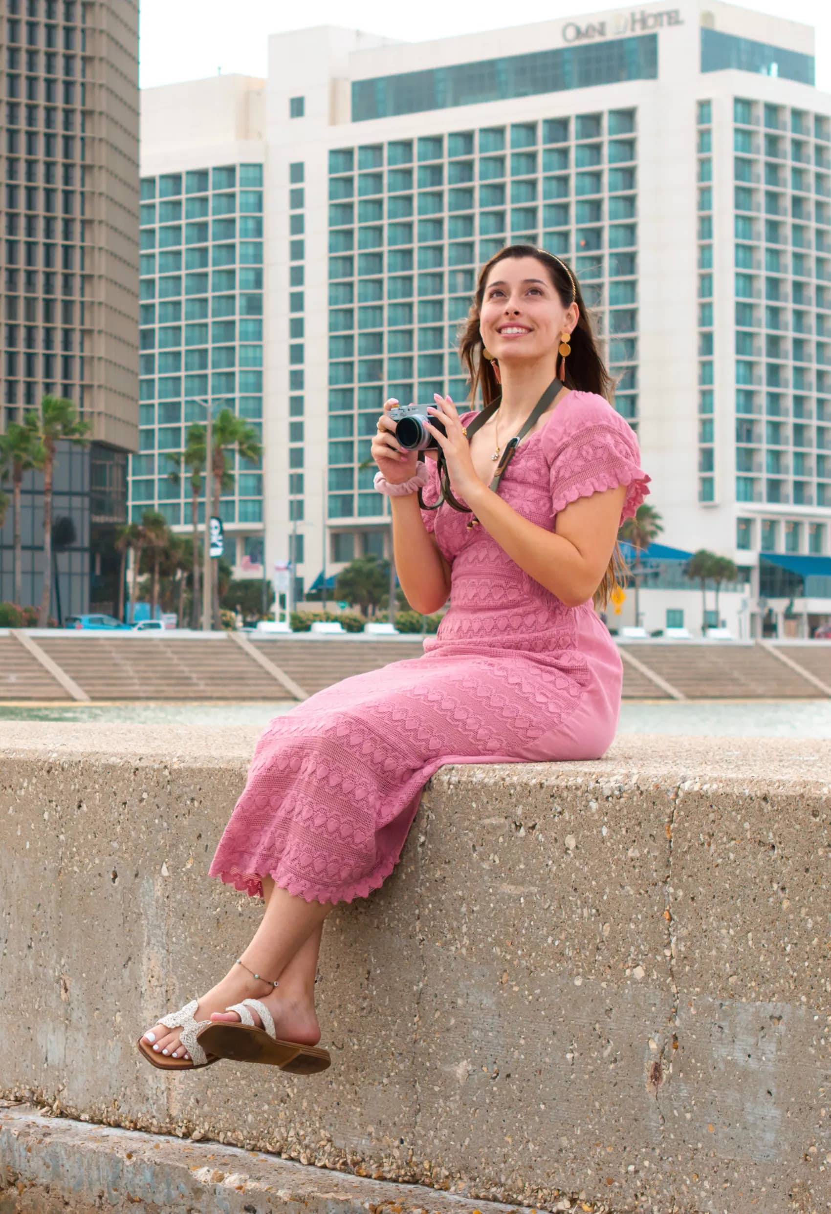 Jaclyn standing along the Texas bayfront with the city skyline behind her