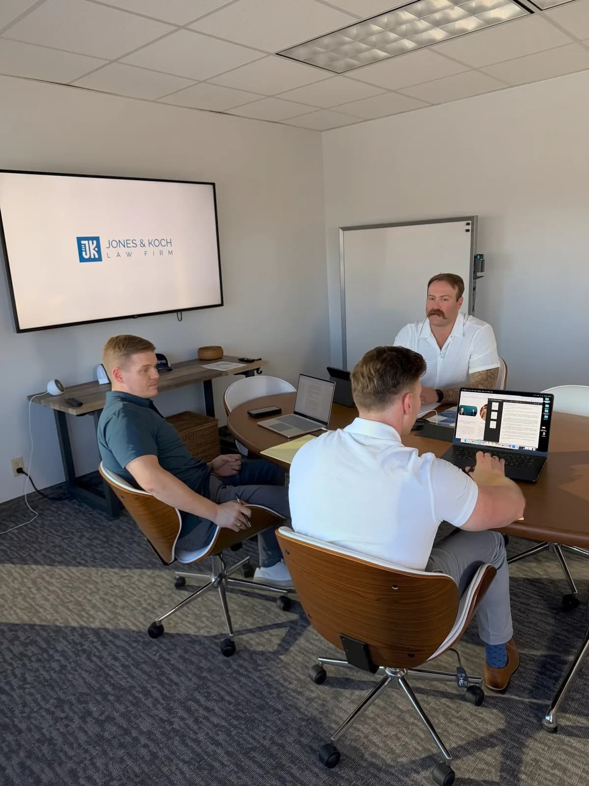 A law firm team in a conference room during a brand content shoot